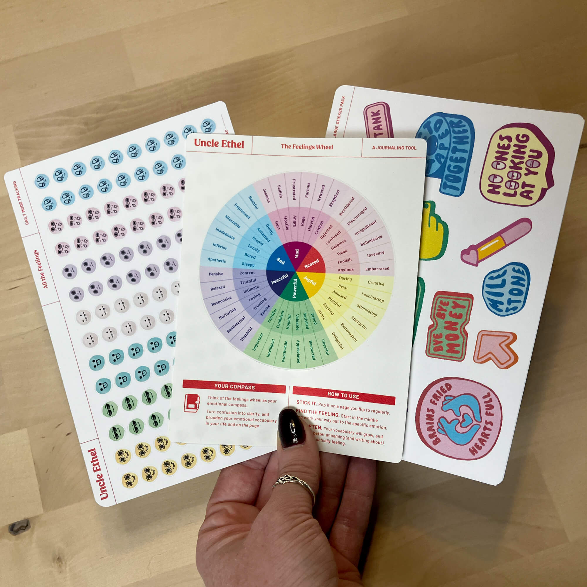 3 fanned out sticker sheets: emotions, feelings wheel, deco